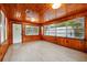 Bright living room with wood walls and new floors at 522 Channing Rd, Lakeland, FL 33805