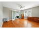 Bright room with a ceiling fan and hardwood floors at 522 Channing Rd, Lakeland, FL 33805
