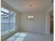 Well-lit dining room featuring tile floors, decorative molding and a chandelier at 5220 Tennessee Ridge Ct, Auburndale, FL 33823