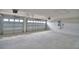 Spacious two-car garage offers ample parking and storage space with automatic door openers at 5220 Tennessee Ridge Ct, Auburndale, FL 33823