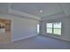 Spacious living room with recessed lights, plush carpeting, and a large window at 5220 Tennessee Ridge Ct, Auburndale, FL 33823