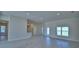 Bright living room featuring tile flooring, recessed lighting, and natural light from the window at 5220 Tennessee Ridge Ct, Auburndale, FL 33823
