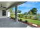 Relaxing view of backyard, landscaping, and patio area at 5390 Clubhouse Hills Ln, Lakeland, FL 33812