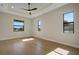 Sun-filled bedroom with wood-look floors, modern ceiling fan, and recessed lighting at 5390 Clubhouse Hills Ln, Lakeland, FL 33812