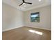 Bedroom boasts hardwood floors, recessed lights, modern ceiling fan and natural light at 5390 Clubhouse Hills Ln, Lakeland, FL 33812
