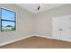 Bedroom with a double door closet and lots of natural light from a large window at 5390 Clubhouse Hills Ln, Lakeland, FL 33812