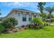Well-maintained home featuring manicured landscaping and a lush green lawn at 5390 Clubhouse Hills Ln, Lakeland, FL 33812