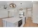 Bright kitchen with quartz counters, an island, and stainless steel appliances at 5390 Clubhouse Hills Ln, Lakeland, FL 33812