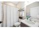 Bathroom featuring a sink with a granite countertop, toilet, and shower with curtain at 5531 Pebble Beach Dr, Lakeland, FL 33812