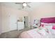 Cozy bedroom featuring a vanity and dresser, carpeted floors, and a ceiling fan at 5531 Pebble Beach Dr, Lakeland, FL 33812