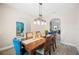Open dining room featuring wood floors, natural light, and seamless flow to other living spaces at 5531 Pebble Beach Dr, Lakeland, FL 33812