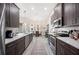 Bright kitchen showcasing stainless steel appliances, modern cabinets, and open access to the dining area at 5531 Pebble Beach Dr, Lakeland, FL 33812