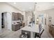 Open kitchen featuring stainless appliances, a large island with seating, and seamless flow to living areas at 5531 Pebble Beach Dr, Lakeland, FL 33812
