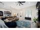 Bright open-concept living room with access to kitchen and dining areas, with luxury vinyl flooring at 5531 Pebble Beach Dr, Lakeland, FL 33812