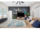 Comfortable living room with a dark accent wall, ceiling fan, and stylish decor at 5531 Pebble Beach Dr, Lakeland, FL 33812