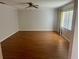 Spacious living room featuring hard wood floors, natural light, and a ceiling fan at 602 Avery Ln # 602, Lakeland, FL 33803