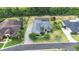 Aerial view of the home with screened in pool and large driveway at 6347 Ashley Dr, Lakeland, FL 33813