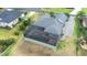 Overhead shot of a property with a screened in pool and paver driveway at 6347 Ashley Dr, Lakeland, FL 33813
