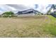 Expansive backyard showcases a gentle slope, providing ample space and potential for landscaping at 6347 Ashley Dr, Lakeland, FL 33813