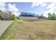 Spacious backyard featuring a large, screened-in pool area perfect for outdoor relaxation and entertainment at 6347 Ashley Dr, Lakeland, FL 33813