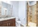 Bathroom features a granite countertop vanity and a tiled walk-in shower at 6347 Ashley Dr, Lakeland, FL 33813