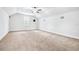 A large bedroom with vaulted ceiling includes a ceiling fan and window at 6347 Ashley Dr, Lakeland, FL 33813