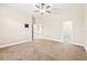 This bedroom features a ceiling fan, neutral paint, and carpet at 6347 Ashley Dr, Lakeland, FL 33813