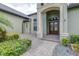 Inviting front entrance featuring a double-door entry and a stone walkway leading to the house at 6347 Ashley Dr, Lakeland, FL 33813