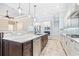 Modern kitchen featuring granite countertops, stainless steel appliances, and a functional island with a sink at 6347 Ashley Dr, Lakeland, FL 33813