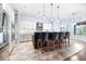 Modern kitchen boasts stainless steel appliances, custom cabinets, and a spacious island with barstool seating at 6347 Ashley Dr, Lakeland, FL 33813