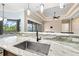 Modern kitchen with granite countertops, stainless steel appliances, and an island bar with backyard views at 6347 Ashley Dr, Lakeland, FL 33813