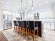 Stunning kitchen with stainless steel appliances, custom cabinets, and a large island with barstool seating at 6347 Ashley Dr, Lakeland, FL 33813