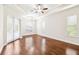 Bright, open living area featuring hardwood floors, modern lighting, and large windows at 6347 Ashley Dr, Lakeland, FL 33813