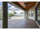 Wonderful screened-in patio featuring a ceiling fan, wood ceiling, and views of the pool and spa at 6347 Ashley Dr, Lakeland, FL 33813
