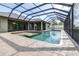 Inviting screened-in pool and spa area, featuring brick pavers and ample space for lounging at 6347 Ashley Dr, Lakeland, FL 33813