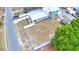 Aerial view of home and backyard with a white vinyl fence and nearby street at 640 Waldon N Ave, Bartow, FL 33830