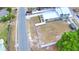 Aerial view of property and street showcasing the home, white fence backyard, mature trees, and surrounding neighborhood at 640 Waldon N Ave, Bartow, FL 33830