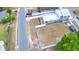 Aerial view of property showing the home, white fence backyard, mature trees, and surrounding neighborhood at 640 Waldon N Ave, Bartow, FL 33830