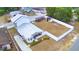 This backyard contains a shed and gazebo with white fencing and a well manicured lawn at 640 Waldon N Ave, Bartow, FL 33830