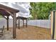 Backyard with wooden patio covers and white vinyl fence for privacy at 640 Waldon N Ave, Bartow, FL 33830