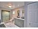 Bathroom featuring a dual sink vanity and glass-enclosed shower at 640 Waldon N Ave, Bartow, FL 33830