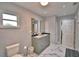 Bathroom featuring a dual sink vanity and glass-enclosed shower at 640 Waldon N Ave, Bartow, FL 33830