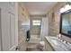 Neutral bathroom with a shower-tub combination and modern vanity at 640 Waldon N Ave, Bartow, FL 33830