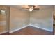 Bedroom featuring wood flooring, a ceiling fan, neutral walls, and white baseboards at 640 Waldon N Ave, Bartow, FL 33830