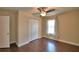 Bedroom with hardwood floors, a ceiling fan, a window, and a closet at 640 Waldon N Ave, Bartow, FL 33830