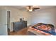 Bedroom with wooden floors, a dresser, and a ceiling fan at 640 Waldon N Ave, Bartow, FL 33830