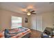 Bedroom featuring wooden floors, closet doors, and a ceiling fan at 640 Waldon N Ave, Bartow, FL 33830