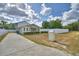 Charming house featuring a long driveway and a white fence, offering classic curb appeal at 640 Waldon N Ave, Bartow, FL 33830