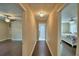 Hallway with views to rooms featuring hardwood flooring and overhead lighting at 640 Waldon N Ave, Bartow, FL 33830