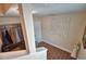 An inviting hallway with wood-look tile floor and decorative wall art at 640 Waldon N Ave, Bartow, FL 33830